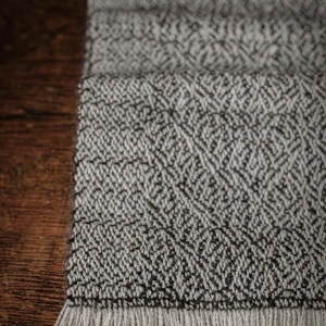 Handwoven Frozen Puddles Narrow Scarf - Natural Charcoal on a White Base